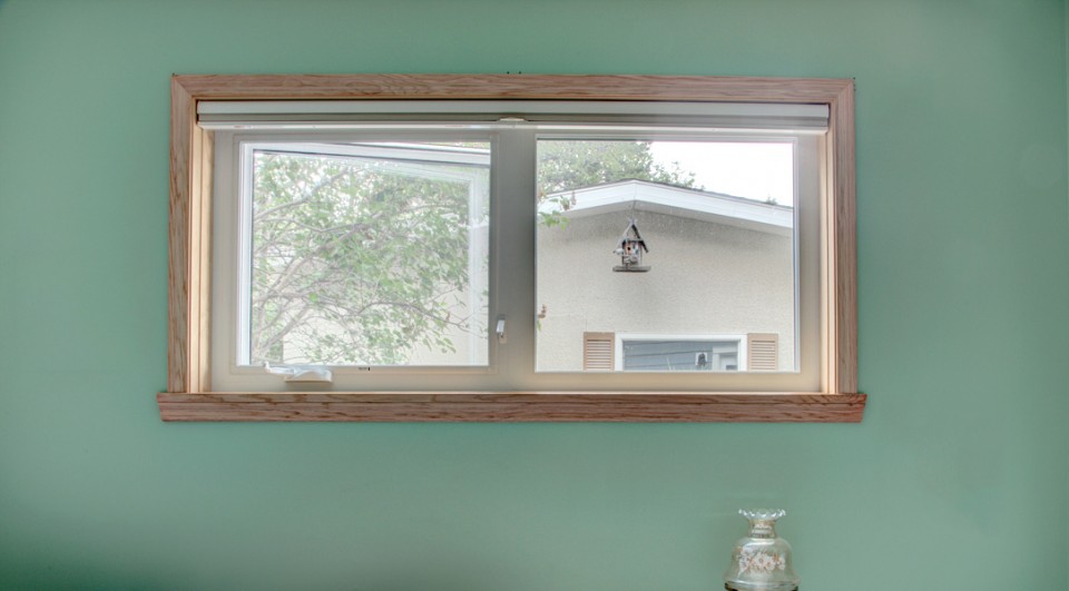Apex 9100 wood framed window in a green room