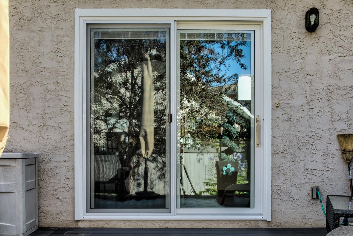 2 wide vantage patio door on the back of a stuccoed home